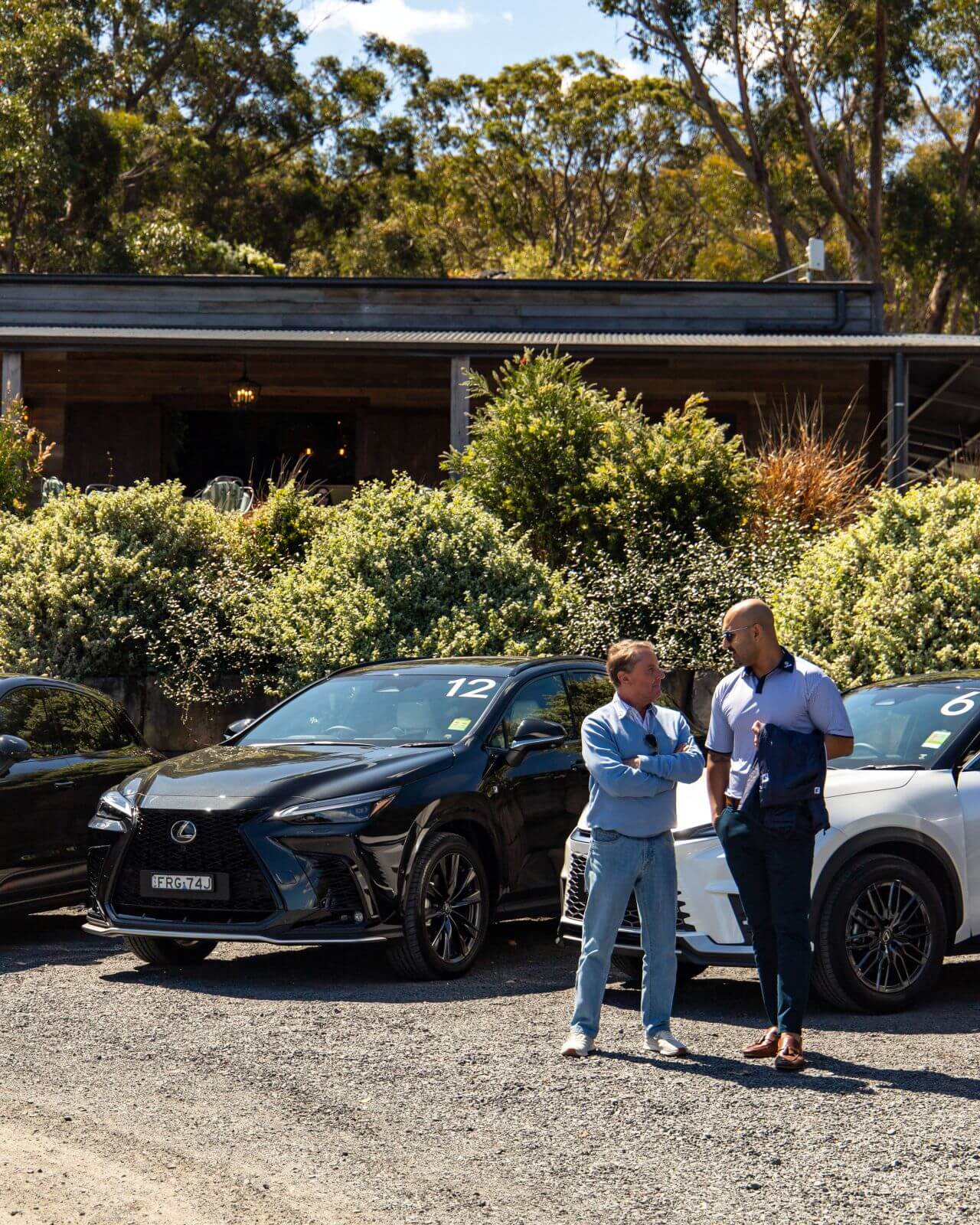 Lexus of Chatswood Drive the Range event: people taking in front of two Lexus cars