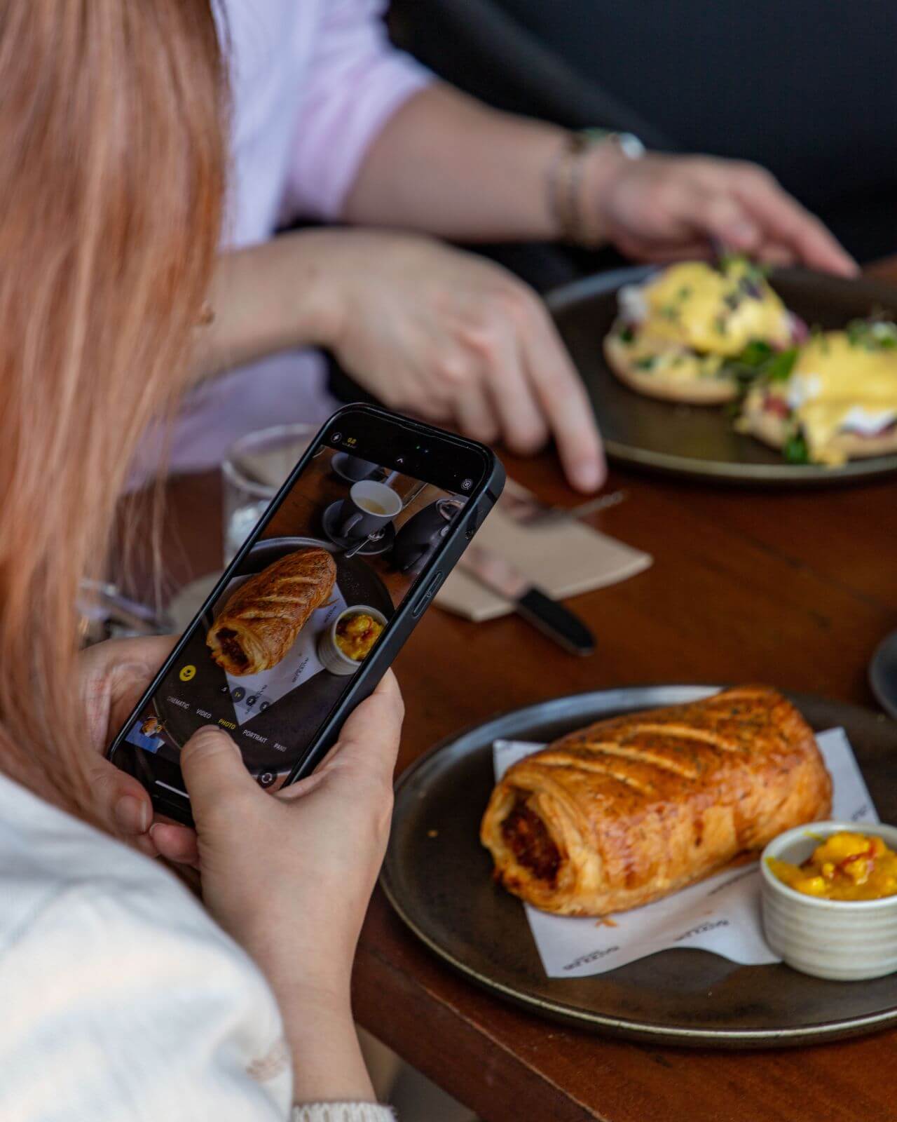Lexus of Chatswood Drive the Range event: customer taking photos of breakfast