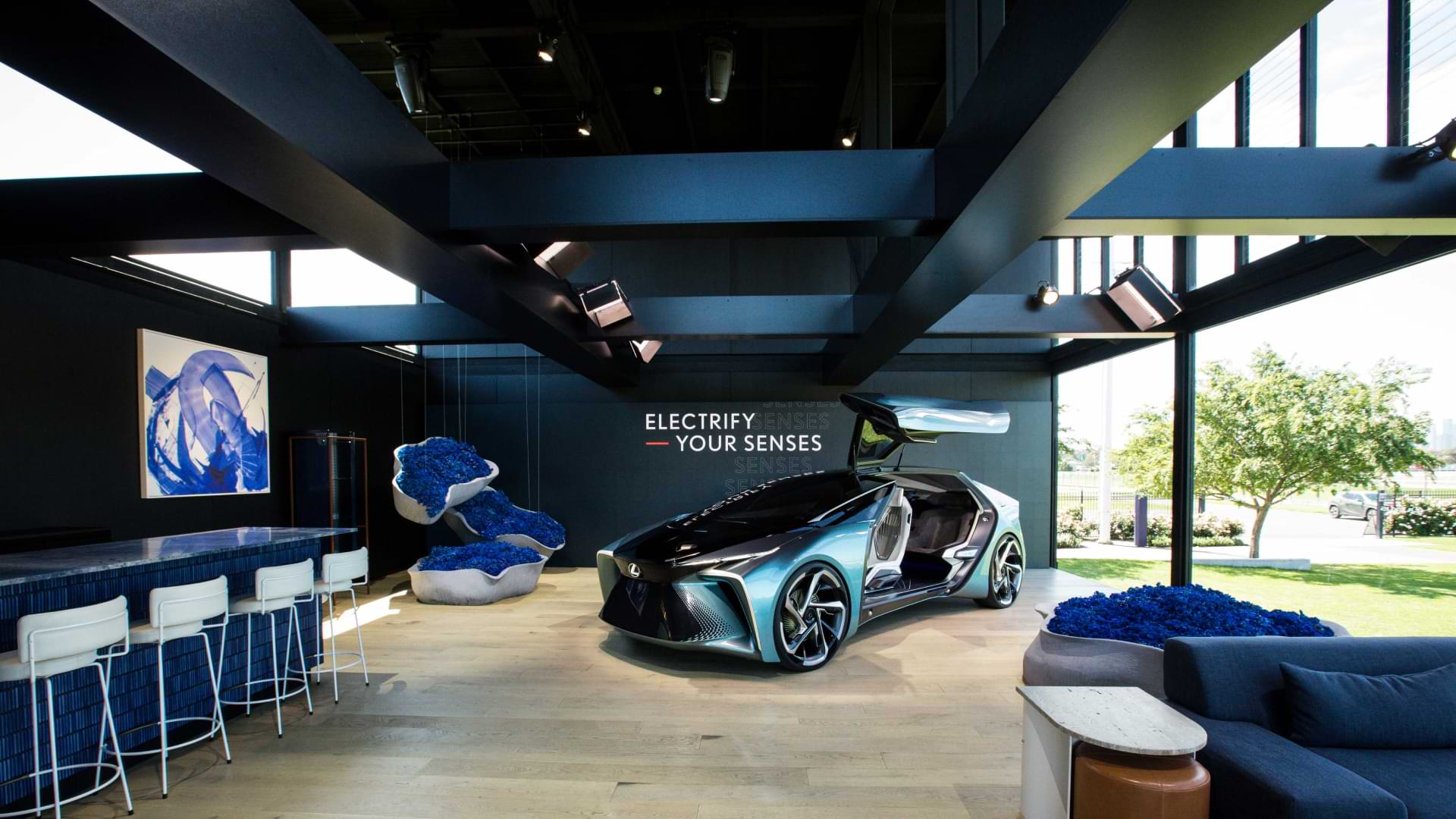 Inside the 2020 Landmark by Lexus tent. The overseas model of the blue Lexus LF-30 Electrified concept vehicle sits with its door open.