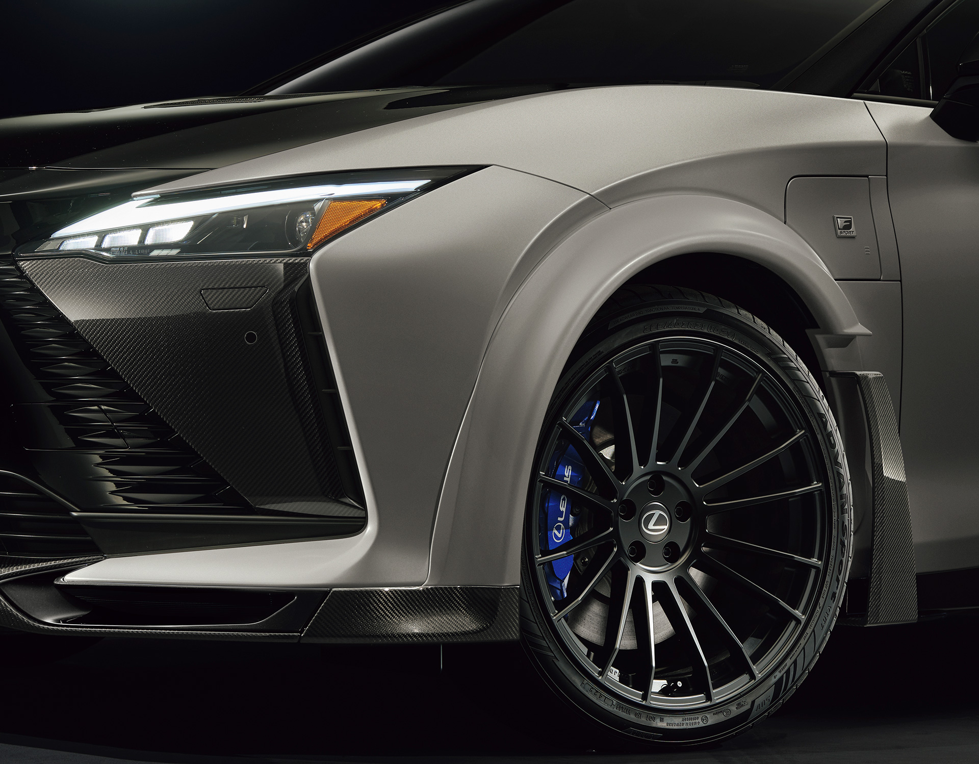 Close-up of the front corner of a white and black Lexus RZ 600e F Sport Performance